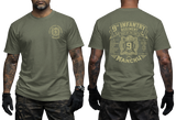 Man wearing military green US Army 9th Infantry "Manchu" t-shirt, showcasing both front chest and detailed large back prints.