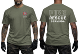 An olive green short-sleeve t-shirt shown on a model from both the front and back. The front features a small red, white, and blue fire department style emblem on the left chest with the word 'BERMUDA' underneath.