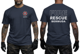 A man modeling a navy blue t-shirt, showing both the front and back views. The front features a small red and white fire department style emblem on the left chest with the word 'BERMUDA' underneath.