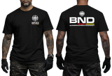 Black tactical t-shirt featuring the BND eagle emblem and logo on the chest. The back shows a large BND print with the full Bundesnachrichtendienst name and German flag colors.