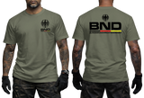 military green tactical t-shirt featuring the BND eagle emblem and logo on the chest. The back shows a large BND print with the full Bundesnachrichtendienst name and German flag colors.