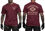 A man modeling a maroon short-sleeve T-shirt shown from the front and back. The front has a small beige chest graphic, and the back features a large beige Yokohama Fire Department logo and text.