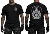 A black short-sleeve T-shirt shown on a model from the front and back. The front has a small white crest graphic on the left chest, and the back has a large white crest with the text 'KING'S OWN SCOTTISH BORDER' arched above it.