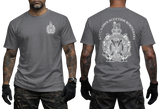 A man modeling a dark gray t-shirt, showing both the front and back views. The front features a small white crest on the left chest, while the back displays a large white crest with the text 'KING'S OWN SCOTTISH BORDERS'.