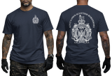 A man modeling a navy blue short-sleeve T-shirt shown from the front and back. The front has a small white crest on the left chest, and the back has a large white crest with the text 'KING'S OWN SCOTTISH BORDER'.