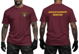 Front and back view of a red t-shirt featuring the yellow Berufsfeuerwehr München logo on the chest and bold back text.