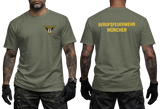 Front and back view of a military-green t-shirt featuring the yellow Berufsfeuerwehr München logo on the chest and bold back text.