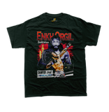 A front view of a green t-shirt featuring a detailed vintage bootleg-style graphic of Mongolian MMA fighter Enkh-Orgil Baatarkhuu. The design includes a distressed portrait of the fighter, the name 'Enkh-Orgil Baatarkhuu' in red text, a red graphic of the Mongolian flag Soyombo symbol, a graphic of another fighter in a submission hold, a 'Champion One' badge, and a warning label. The t-shirt is displayed flat on a white background, complete with a small Supremashirt.com neck label inside the collar.