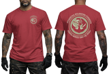 Two-view composite image of a red t-shirt featuring Polish Navy Special Forces JW Formoza graphics. The left side shows the front of the shirt with a small circular chest emblem. The right side shows the back of the shirt with a large circular crest featuring the unit's emblem and motto text. The shirt is displayed on a male model with tattooed arms and tactical gloves.