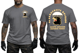 Front and back views of a man wearing a charcoal SADF 44 Parachute Brigade T-Shirt. Features a parachute and eagle head emblem on the left chest and a large back graphic displaying "44 Parachute Brigade South African Defence Force" with the airborne crest.