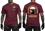 Front and back views of a man wearing a maroon SADF 44 Parachute Brigade T-Shirt. Features a parachute and eagle head emblem on the left chest and a large back graphic displaying "44 Parachute Brigade South African Defence Force" with the airborne crest.
