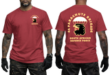 Front and back views of a man wearing a red SADF 44 Parachute Brigade T-Shirt. Features a parachute and eagle head emblem on the left chest and a large back graphic displaying "44 Parachute Brigade South African Defence Force" with the airborne crest.