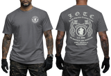 Front and back view of a dark grey U.S. Army J.O.T.C. Jungle Operation Training Center T-shirt featuring the Jungle Expert patch, twin snakes, and Fort Sherman Panama text.