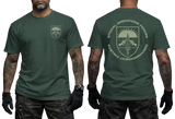 A dark green t-shirt shown on a model from both the front and back views. The front features a small shield logo on the left chest, while the back displays a large military-style parachute graphic with the text 'SPECIAL OPERATIONS FORCES AUSTRIA JAGGKOMMANDO'.