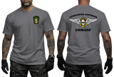 grey graphic tee featuring Comandos Anfíbios COMANF skull, anchor, and wings insignia on chest and back