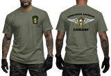 military green graphic tee featuring Comandos Anfíbios COMANF skull, anchor, and wings insignia on chest and back