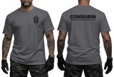 Front and back view of the charcoal COMSUBIN Italian Navy Special Forces t-shirt by Supremashirt. Features the tactical unit insignia on the front left chest and the bold white text "COMSUBIN - Comando Raggruppamento Subacquei e Incursori" on the back. Modeler has visible arm tattoos.