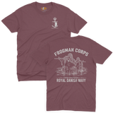 Two-view composite image of a maroon t-shirt featuring Royal Danish Navy Frogman Corps (Frømandskorpset) graphics. The top view shows the front of the shirt with a small anchor, shield, and crown chest emblem and 'Frømandskorpset' text. The bottom view shows the back of the shirt with a large graphic of frogman commandos wading through water with rifles, 'Frogman Corps' heading, and 'Royal Danish Navy' text at the bottom.