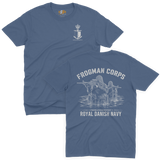 Two-view composite image of a blue t-shirt featuring Royal Danish Navy Frogman Corps (Frømandskorpset) graphics. The top view shows the front of the shirt with a small anchor, shield, and crown chest emblem and 'Frømandskorpset' text. The bottom view shows the back of the shirt with a large graphic of frogman commandos wading through water with rifles, 'Frogman Corps' heading, and 'Royal Danish Navy' text at the bottom.