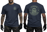 Front and back views of a navy blue t-shirt worn by a model. The front features a small circular logo on the left chest, and the back features a large circular logo with the text 'PLONGEUR D'INTERVENTION' in olive green.