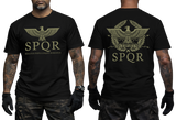 Two-view composite image of a black t-shirt featuring Roman-inspired SPQR graphics. The left side shows the front of the shirt with a small emblem. The right side shows the back of the shirt with a large imperial eagle graphic and 'SPQR' text. The shirt is displayed on a male model with tattooed arms and tactical gloves.