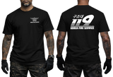 Front and back view of a tattooed male model wearing a tactical Black t-shirt. The left chest features a small white winged "KOREA FIRE SERVICE" emblem. The back showcases a large white "119" graphic with Korean Hangeul text "구조대" above it and "KOREA FIRE SERVICE" printed below.