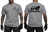 Front and back view of a tattooed male model wearing a tactical Gray t-shirt. The left chest features a small black winged "KOREA FIRE SERVICE" emblem. The back showcases a large black "119" graphic with Korean Hangeul text "구조대" above it and "KOREA FIRE SERVICE" printed below.