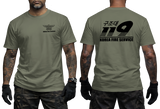 Front and back view of a tattooed male model wearing a tactical Military Green t-shirt. The left chest features a small black winged "KOREA FIRE SERVICE" emblem. The back showcases a large black "119" graphic with Korean Hangeul text "구조대" above it and "KOREA FIRE SERVICE" printed below.