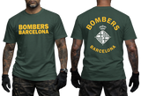 A dark green short-sleeve t-shirt shown on a model from both the front and back. The front features 'BOMBERS BARCELONA' printed in yellow across the chest, and the back features a large yellow and white 'BOMBERS BARCELONA' graphic with a crown and diamond crest.