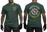 A dark green short-sleeve t-shirt shown on a model from both the front and back. The front features a small circular chest logo for 'Merseyside Fire & Rescue Service'.