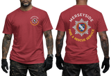 A red short-sleeve t-shirt shown on a model from both the front and back. The front features a small circular Merseyside Fire & Rescue Service logo on the left chest.